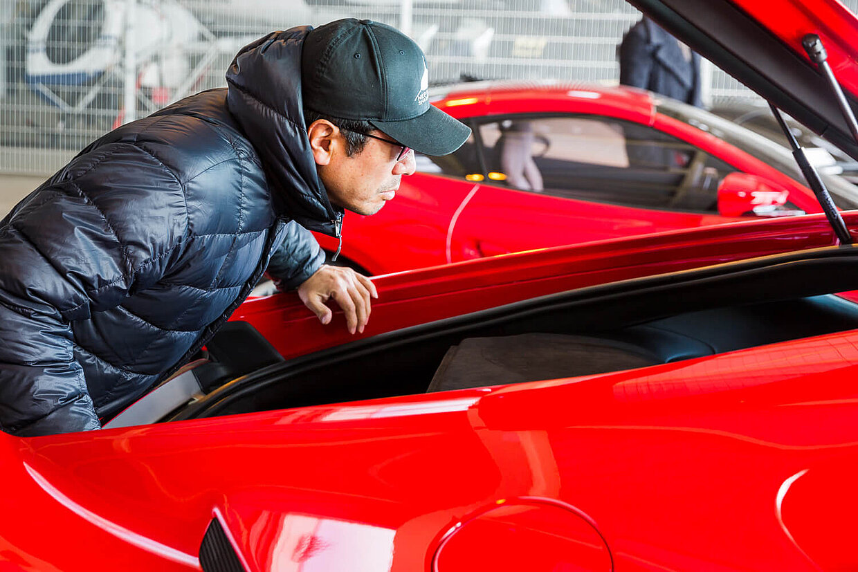 Ken Okuyama tests the trunk of the Ferrari Portofino